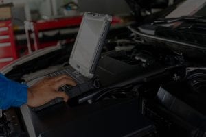 Mechanic uses his laptop