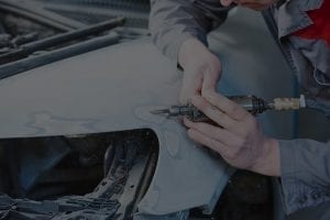 mechanic uses air pressure tool